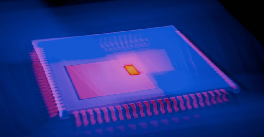 Blurred abstract image of a microchip with heatmap colors highlighting technological innovation.