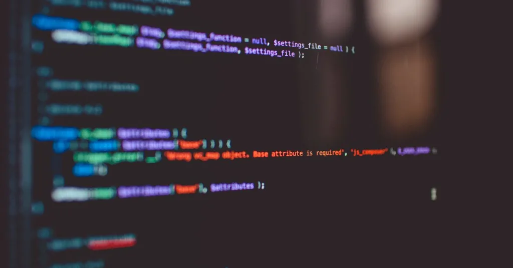 Close-up of colorful programming code displayed on a computer screen.