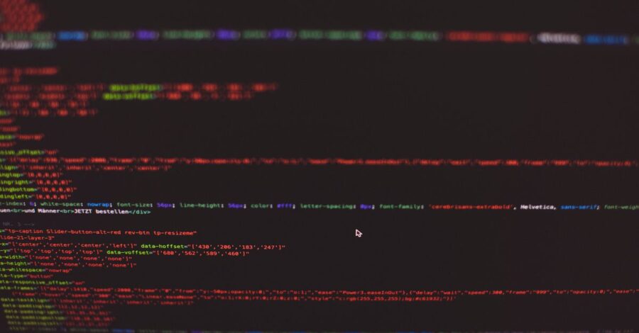 Close-up view of colorful CSS and HTML code displayed on a dark computer screen.